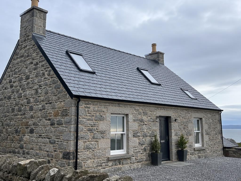 Completed natural slate re-roof on a stone cottage in Aberdeenshire